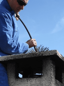 Man Cleaning Chimney, Chimney Sweeps in Ashford, Kent